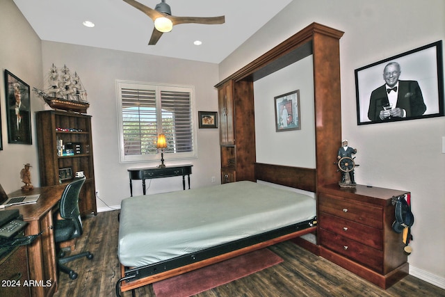 bedroom featuring ceiling fan and dark hardwood / wood-style floors