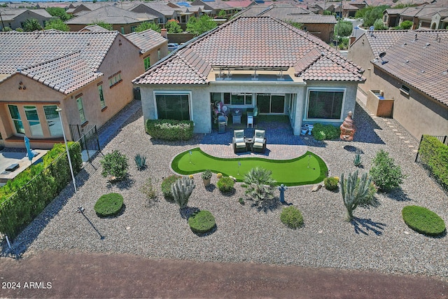 view of front facade with an outdoor living space and a patio area