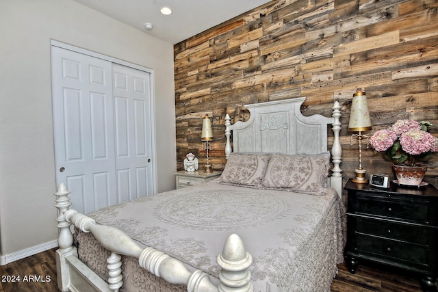 bedroom featuring dark hardwood / wood-style flooring and a closet