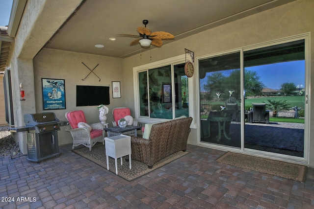 view of patio featuring area for grilling and ceiling fan