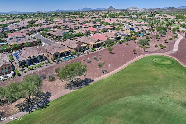 birds eye view of property with a mountain view