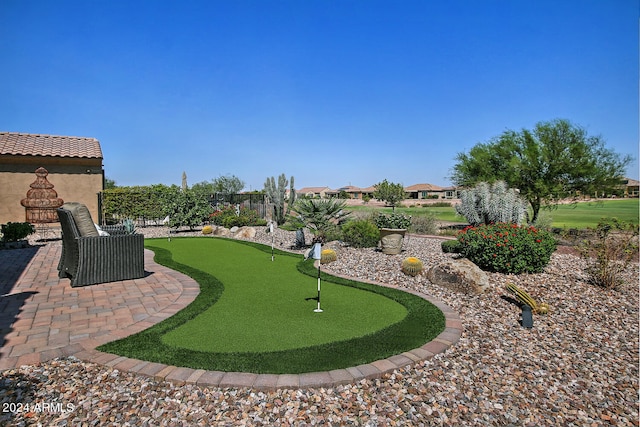 surrounding community featuring a patio