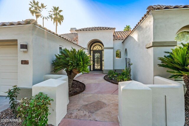 1724 W Blue Ridge Way, Chandler, AZ 85248 - property entrance featuring stucco siding, a tile roof, and a garage
