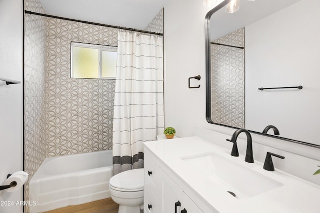 bathroom with vanity, shower / bath combination with curtain, and toilet