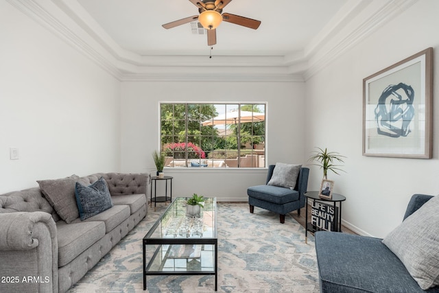 13034 W Krall Ct, Glendale, AZ 85307 - living area featuring ceiling fan, ornamental molding, and a tray ceiling