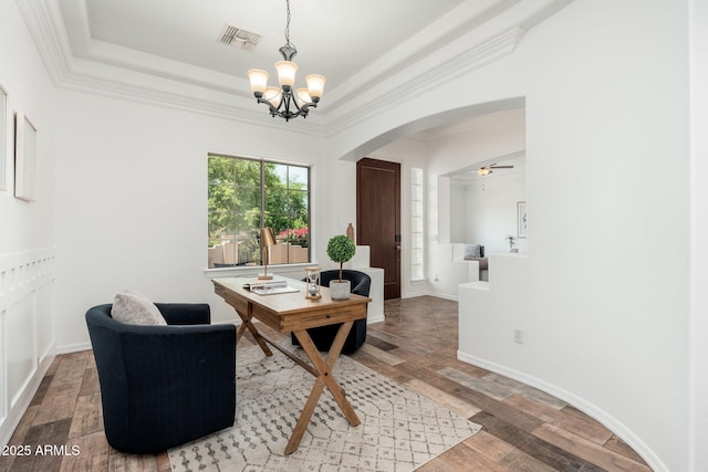 13034 W Krall Ct, Glendale, AZ 85307 - office area with arched walkways, a chandelier, light wood-type flooring, crown molding, and a raised ceiling