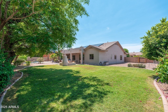 13034 W Krall Ct, Glendale, AZ 85307 - back of property with stucco siding, a fenced backyard, a patio area, and outdoor lounge area