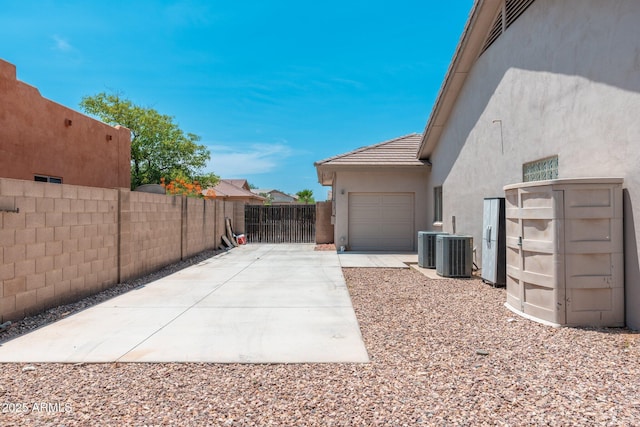 13034 W Krall Ct, Glendale, AZ 85307 - view of property exterior with stucco siding, a garage, driveway, and a tile roof