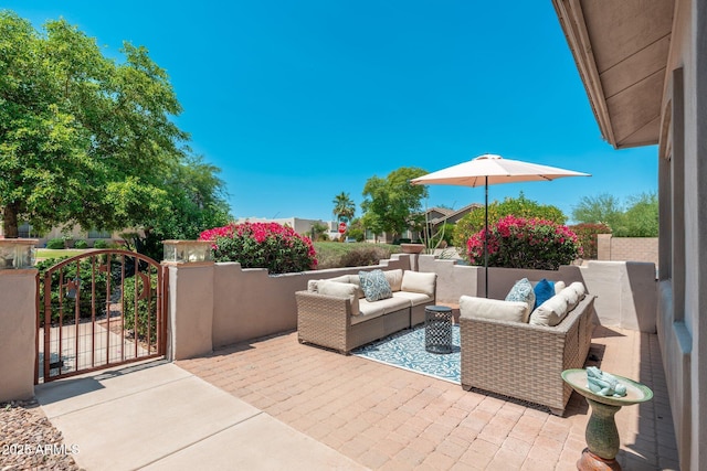 13034 W Krall Ct, Glendale, AZ 85307 - view of patio featuring outdoor lounge area and a gate