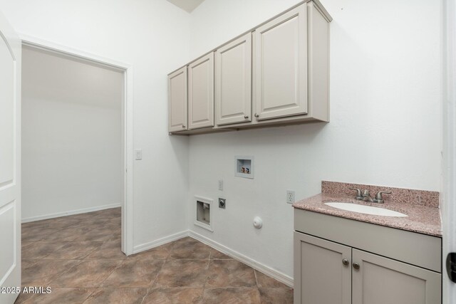 13034 W Krall Ct, Glendale, AZ 85307 - laundry area featuring washer hookup, hookup for an electric dryer, hookup for a gas dryer, and cabinet space