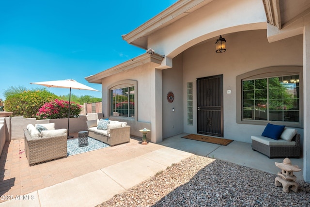 13034 W Krall Ct, Glendale, AZ 85307 - view of exterior entry with stucco siding, a patio, and outdoor lounge area
