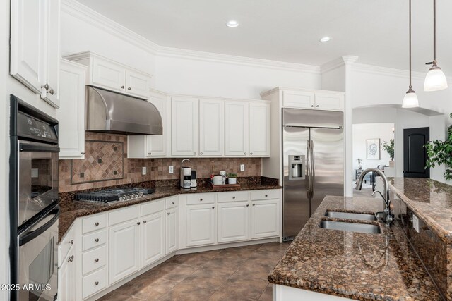 13034 W Krall Ct, Glendale, AZ 85307 - kitchen featuring stainless steel appliances, ornamental molding, under cabinet range hood, white cabinetry, and decorative light fixtures