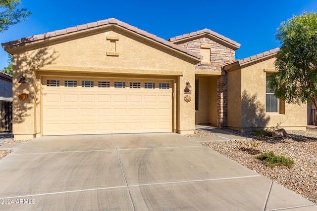 view of front of property with a garage