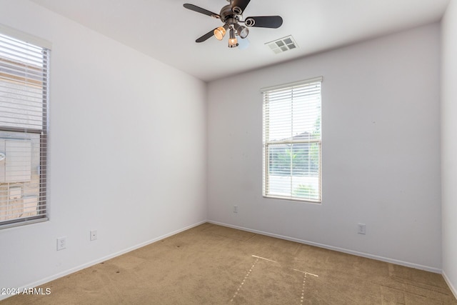 4548 E Carob Dr, Gilbert, AZ 85298 - carpeted spare room with healthy amount of natural light, a ceiling fan, and baseboards