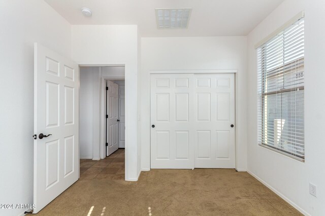 4548 E Carob Dr, Gilbert, AZ 85298 - unfurnished bedroom with carpet, baseboards, and a closet