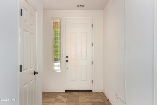 entryway featuring light tile patterned floors