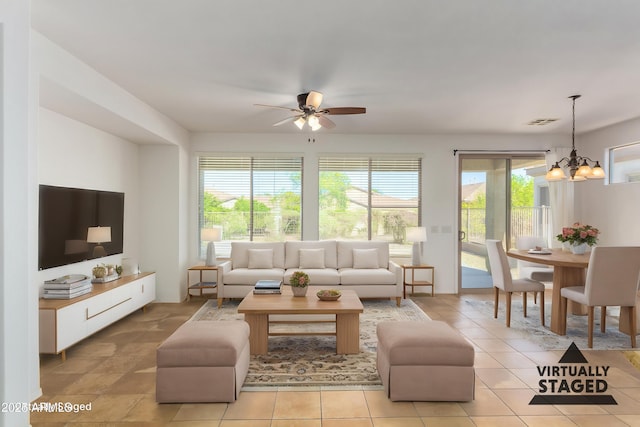 4548 E Carob Dr, Gilbert, AZ 85298 - living area with plenty of natural light, ceiling fan, and a chandelier