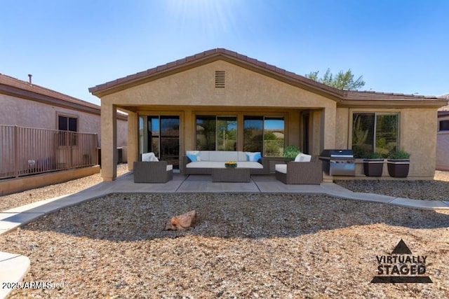 4548 E Carob Dr, Gilbert, AZ 85298 - rear view of house with an outdoor living space, a patio, and stucco siding