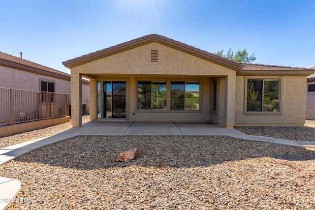 4548 E Carob Dr, Gilbert, AZ 85298 - rear view of property with stucco siding, a patio area, and a tile roof