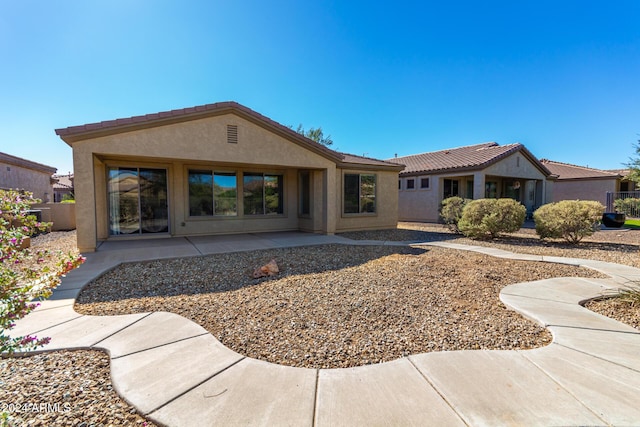 4548 E Carob Dr, Gilbert, AZ 85298 - rear view of property with stucco siding, a patio area, and a tile roof