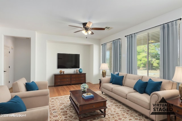 4548 E Carob Dr, Gilbert, AZ 85298 - living area with a ceiling fan and wood finished floors
