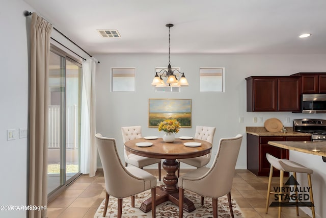 4548 E Carob Dr, Gilbert, AZ 85298 - dining area featuring light tile patterned floors, a chandelier, and recessed lighting