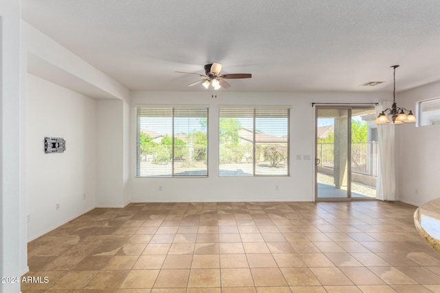 4548 E Carob Dr, Gilbert, AZ 85298 - unfurnished room featuring a chandelier, ceiling fan, baseboards, and light tile patterned flooring