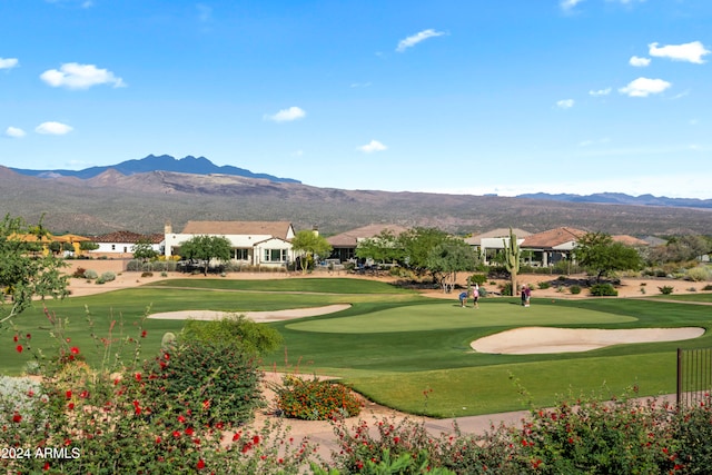 surrounding community featuring a mountain view