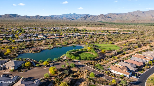 drone / aerial view with a water and mountain view