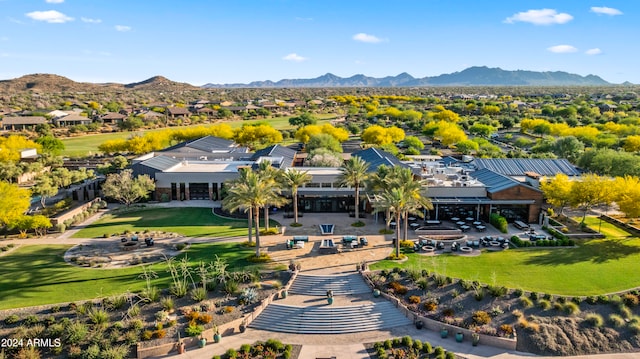 birds eye view of property with a mountain view