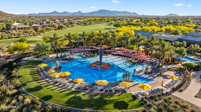 view of swimming pool featuring a mountain view