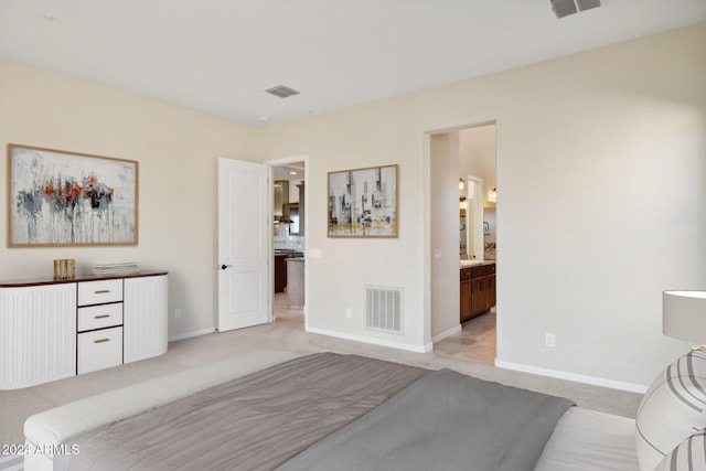 carpeted bedroom with ensuite bathroom