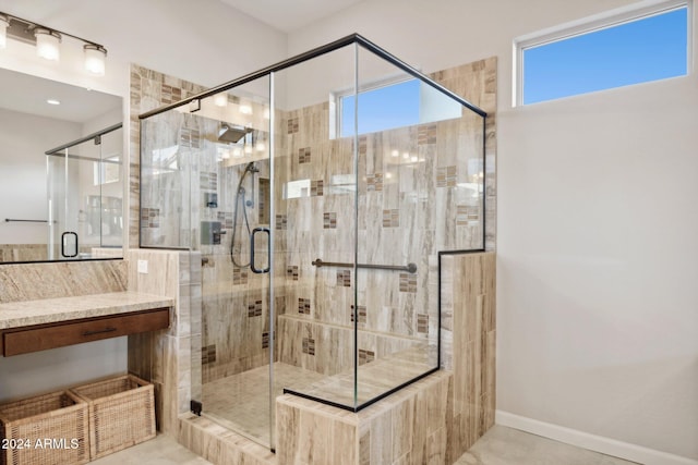 bathroom featuring a shower with shower door