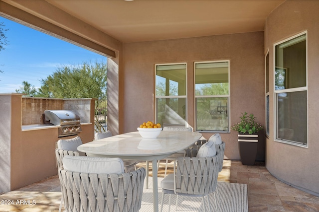 view of patio with an outdoor kitchen and area for grilling