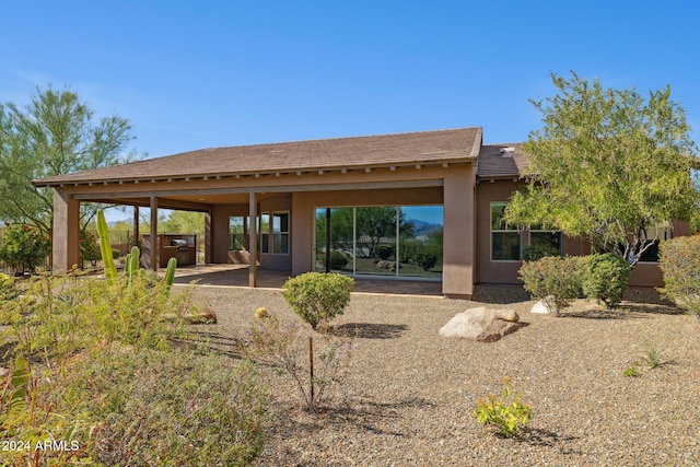 back of house featuring a patio