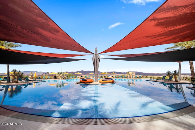 view of pool with a mountain view