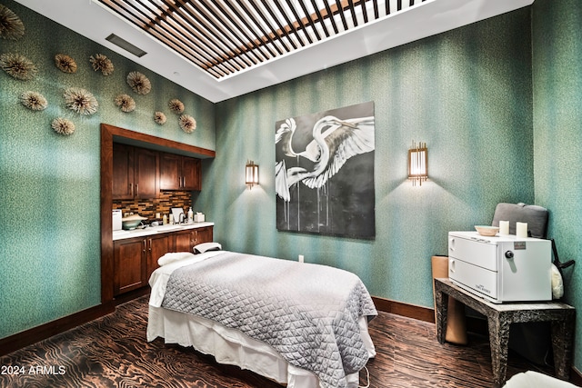 bedroom featuring dark hardwood / wood-style floors