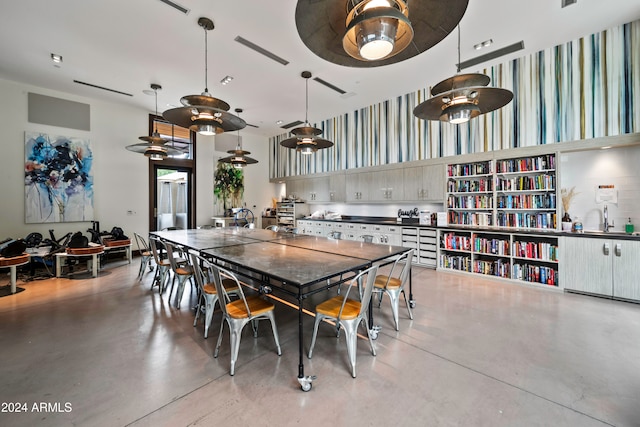 dining room with concrete flooring and sink