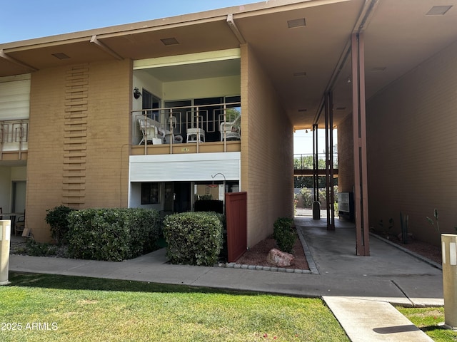 exterior space featuring brick siding