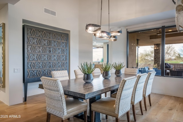 dining area featuring light wood-type flooring