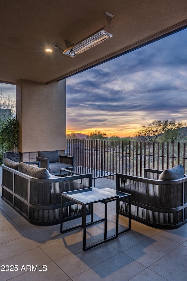 patio terrace at dusk with an outdoor living space