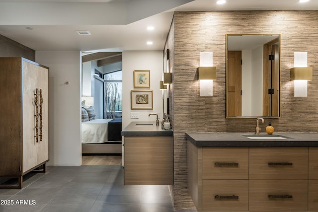 bathroom with tile patterned flooring and vanity