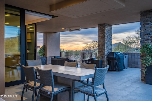 patio terrace at dusk with area for grilling