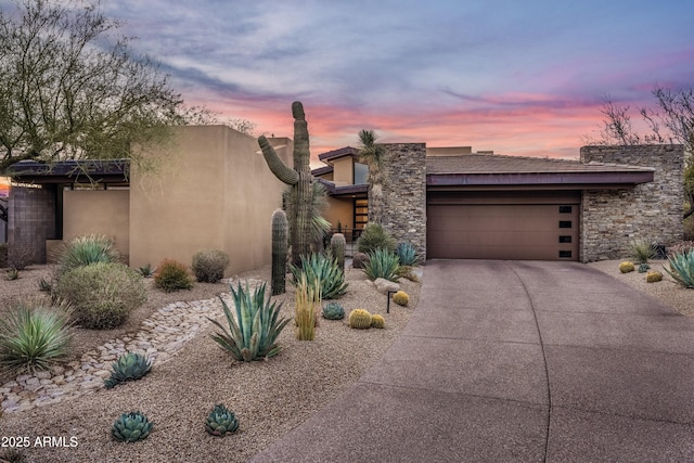 view of front of property with a garage