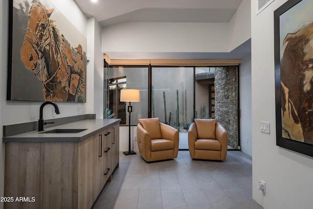 interior space featuring sink and light tile patterned floors