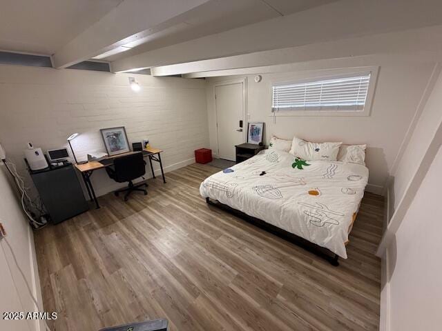 5833 N 10th St, Phoenix, AZ 85014 - bedroom with wood finished floors and beamed ceiling