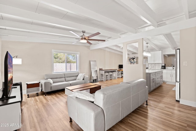 5833 N 10th St, Phoenix, AZ 85014 - living room featuring light wood-style flooring and ceiling fan