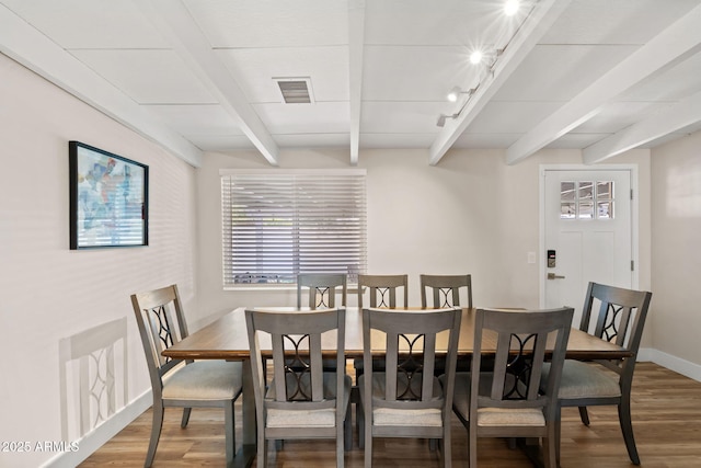 5833 N 10th St, Phoenix, AZ 85014 - dining space featuring wood finished floors, beam ceiling, and track lighting