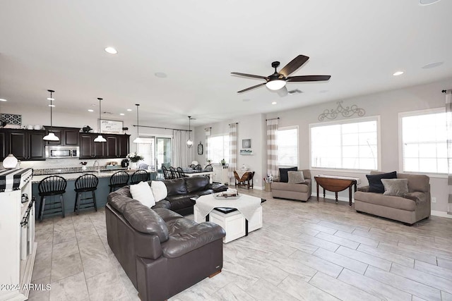 living room featuring ceiling fan