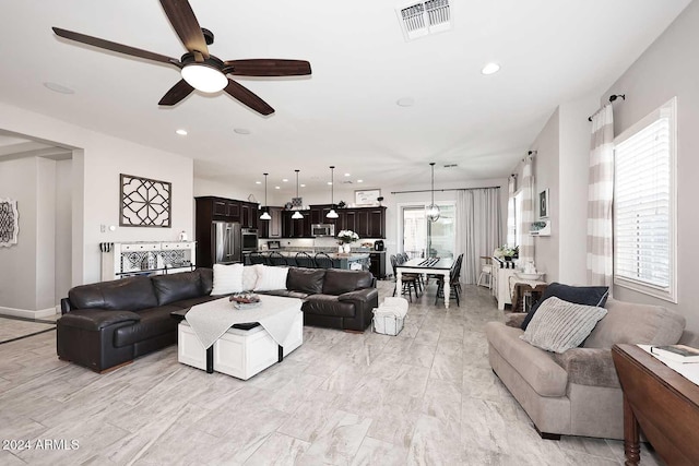 living room with ceiling fan